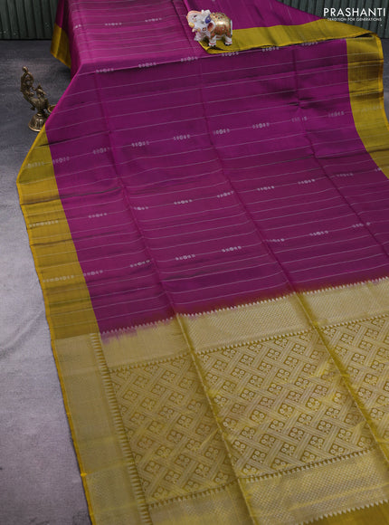 Kanchipuram soft silk saree purple and mustard yellow with allover silver zari weaves and long zari woven annam butta border