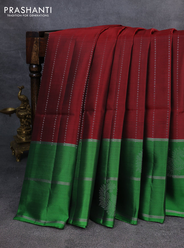 Kanchipuram soft silk saree maroon and green with allover silver zari weaves and long zari woven annam butta border