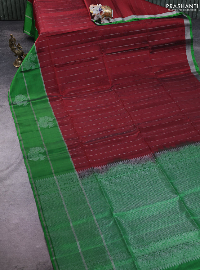 Kanchipuram soft silk saree maroon and green with allover silver zari weaves and long zari woven annam butta border