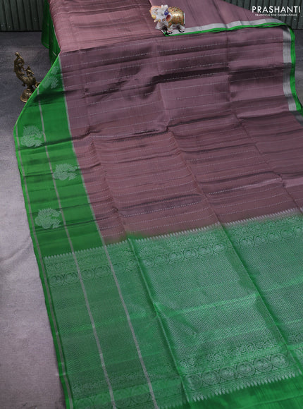 Kanchipuram soft silk saree pastel brown and green with allover silver zari weaves and long zari woven annam butta border