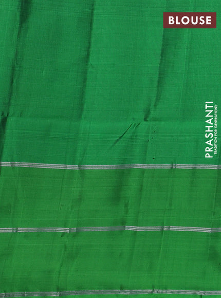 Kanchipuram soft silk saree pastel brown and green with allover silver zari weaves and long zari woven annam butta border