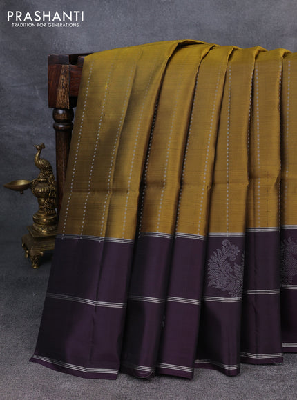 Kanchipuram soft silk saree mehendi green and deep violet with allover silver zari weaves and long zari woven annam butta border