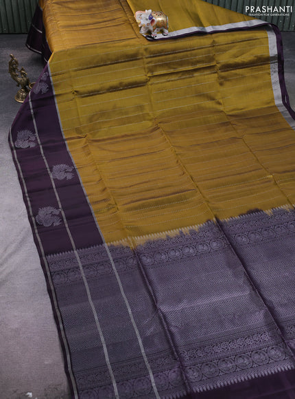 Kanchipuram soft silk saree mehendi green and deep violet with allover silver zari weaves and long zari woven annam butta border