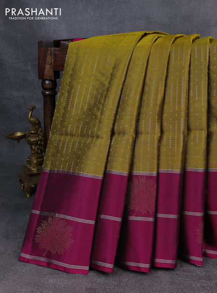 Kanchipuram soft silk saree mehendi green and magenta pink with allover silver & gold zari weaves and long zari woven border