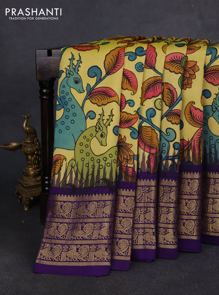 Pure kanchipuram pen kalamkari saree lime yellow and blue with allover penkalamkari prints and zari woven border