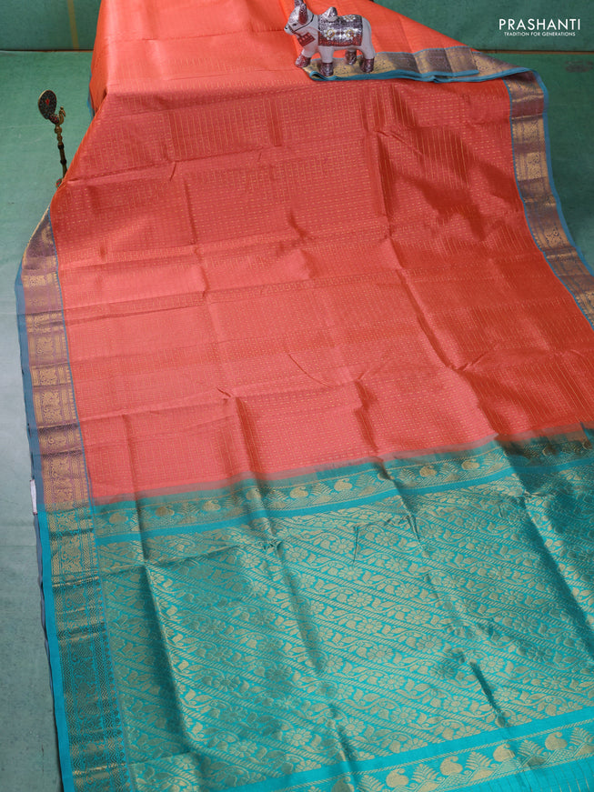 Silk cotton saree orange and teal blue with allover zari checks & lakshadeepam weaves and zari woven border