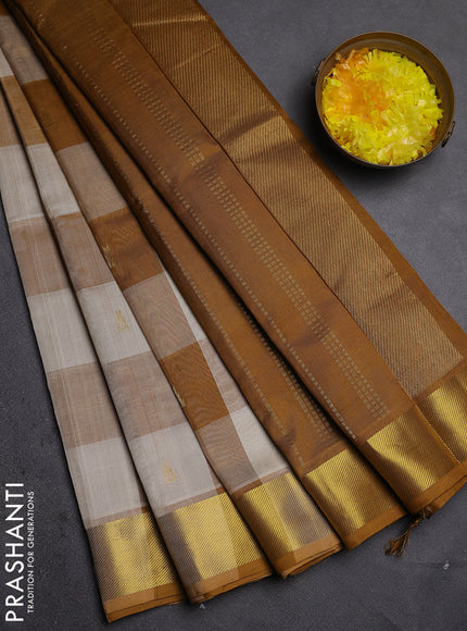Silk cotton saree cream and dark mustard with allover paalum pazhamum checks & zari buttas and zari woven border