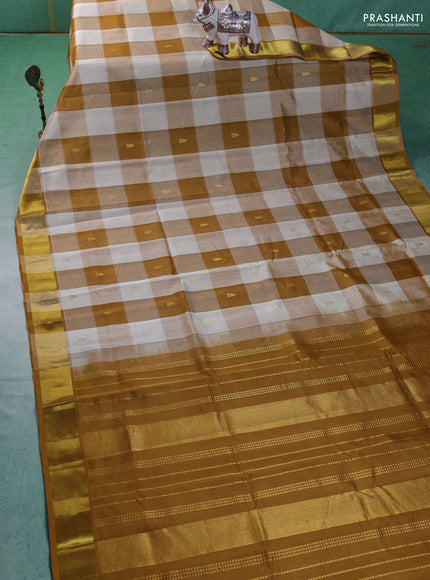 Silk cotton saree cream and dark mustard with allover paalum pazhamum checks & zari buttas and zari woven border