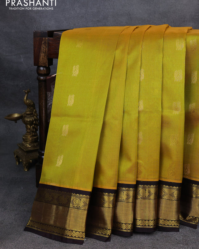 Kuppadam silk cotton saree yellow and coffee brown with annam zari woven buttas and zari woven border
