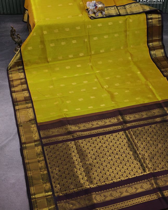 Kuppadam silk cotton saree yellow and coffee brown with annam zari woven buttas and zari woven border