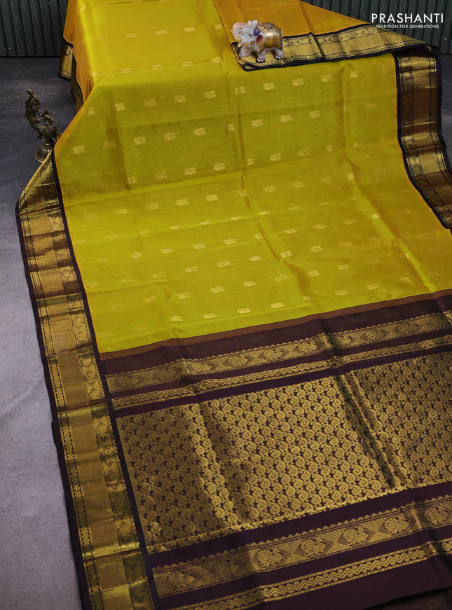 Kuppadam silk cotton saree yellow and coffee brown with annam zari woven buttas and zari woven border
