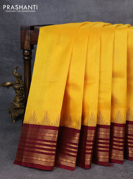 Kuppadam silk cotton saree yellow and maroon with zari woven buttas and temple design zari woven border