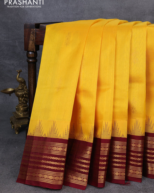 Kuppadam silk cotton saree yellow and maroon with zari woven buttas and temple design zari woven border
