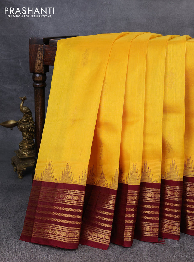Kuppadam silk cotton saree yellow and maroon with zari woven buttas and temple design zari woven border