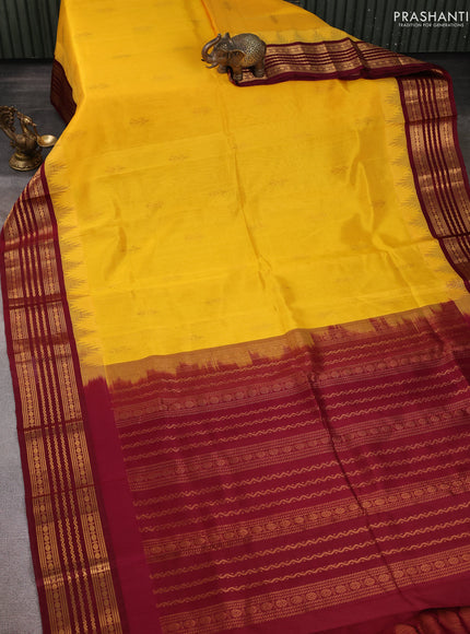 Kuppadam silk cotton saree yellow and maroon with zari woven buttas and temple design zari woven border