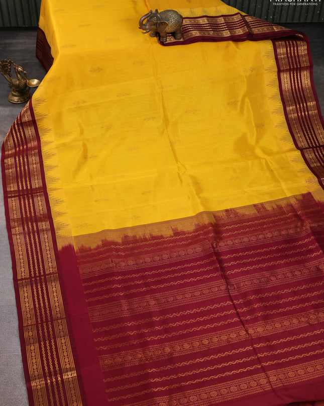 Kuppadam silk cotton saree yellow and maroon with zari woven buttas and temple design zari woven border