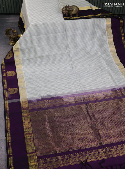 Kuppadam silk cotton saree cream and violet with allover thread woven checked pattern and rettapet zari woven border