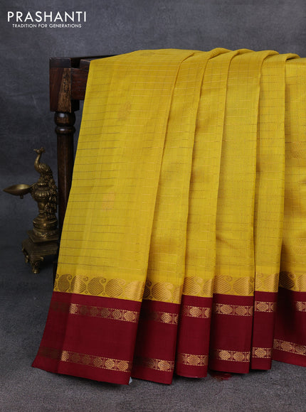 Kuppadam silk cotton saree yellow and maroon with allover zari checks & buttas and rettapet zari woven border