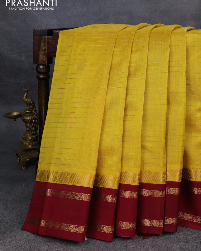Kuppadam silk cotton saree yellow and maroon with allover zari checks & buttas and rettapet zari woven border