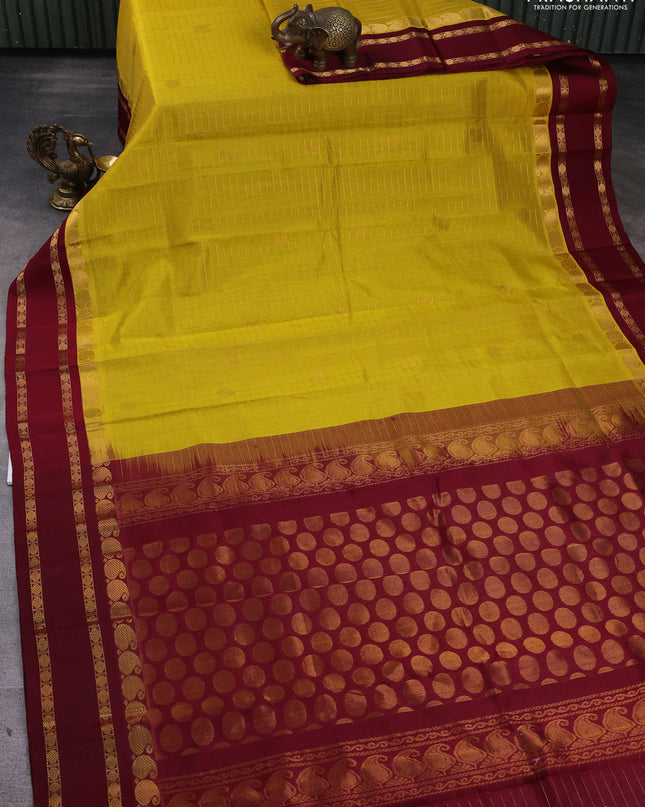 Kuppadam silk cotton saree yellow and maroon with allover zari checks & buttas and rettapet zari woven border