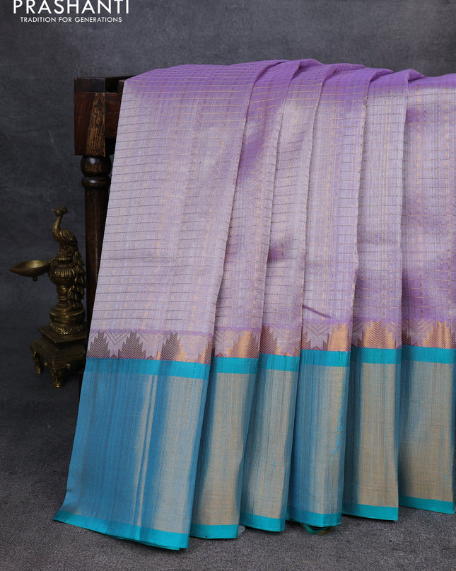 Kuppadam silk cotton saree pastel lavender and teal blue with allover zari checks & lakshadeepam weaves and temple design zari checked border