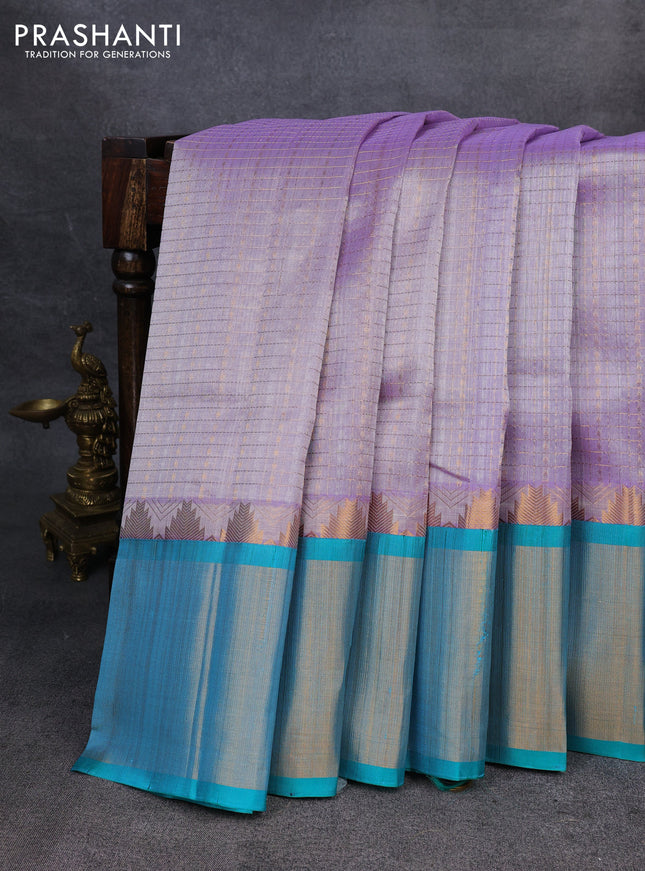 Kuppadam silk cotton saree pastel lavender and teal blue with allover zari checks & lakshadeepam weaves and temple design zari checked border