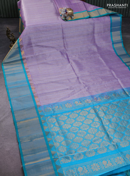 Kuppadam silk cotton saree pastel lavender and teal blue with allover zari checks & lakshadeepam weaves and temple design zari checked border