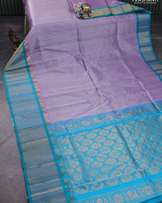 Kuppadam silk cotton saree pastel lavender and teal blue with allover zari checks & lakshadeepam weaves and temple design zari checked border