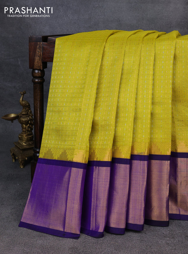 Kuppadam silk cotton saree lime yellow and blue with allover zari checks & lakshadeepam weaves and temple design zari checked border