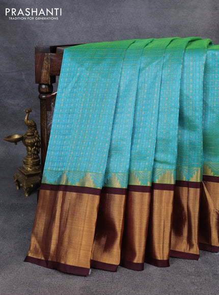 Kuppadam silk cotton saree teal blue and deep maroon with allover zari checks & lakshadeepam weaves and temple design zari checked border
