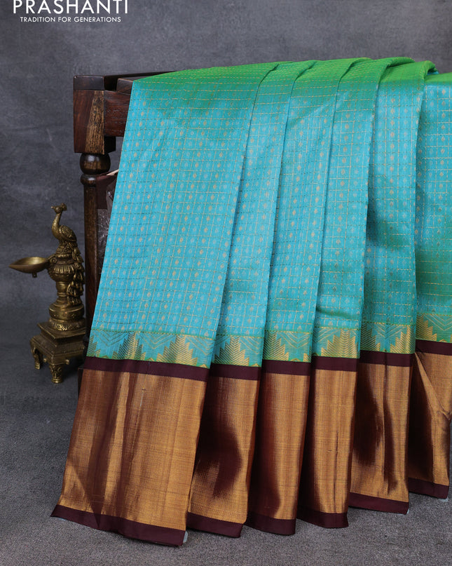 Kuppadam silk cotton saree teal blue and deep maroon with allover zari checks & lakshadeepam weaves and temple design zari checked border