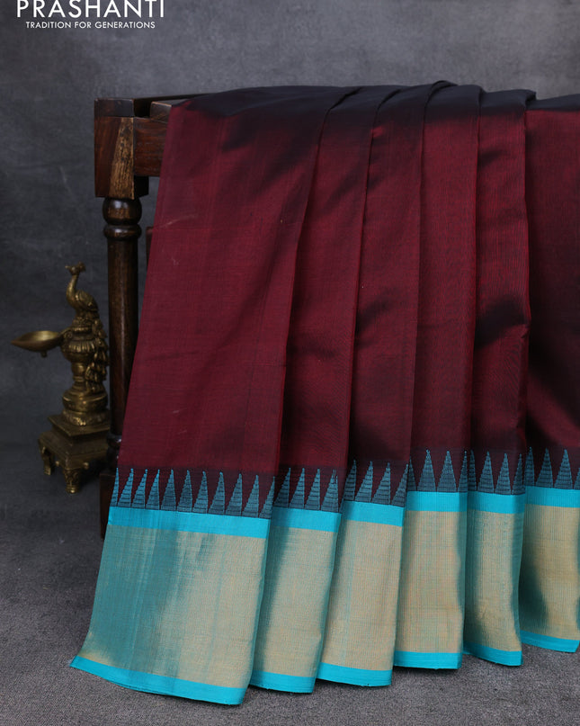 Kuppadam silk cotton saree deep maroon and teal blue with plain body and temple design zari checked border