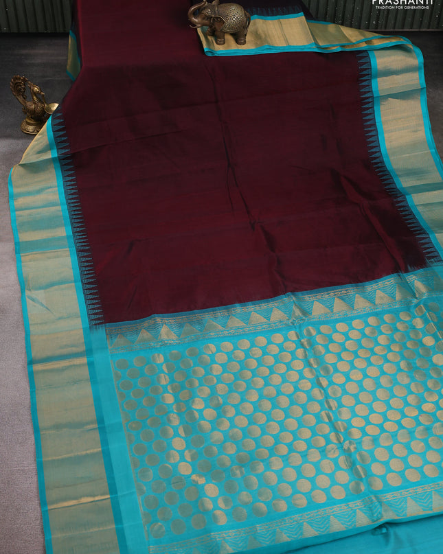 Kuppadam silk cotton saree deep maroon and teal blue with plain body and temple design zari checked border