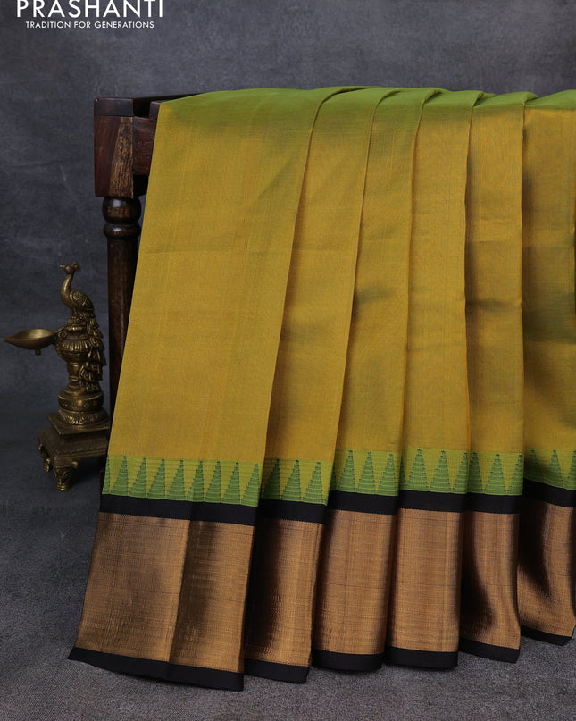 Kuppadam silk cotton saree lime green and black with plain body and temple design zari checked border