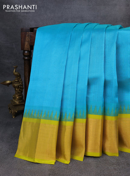 Kuppadam silk cotton saree teal blue and lime yellow with plain body and temple design zari checked border