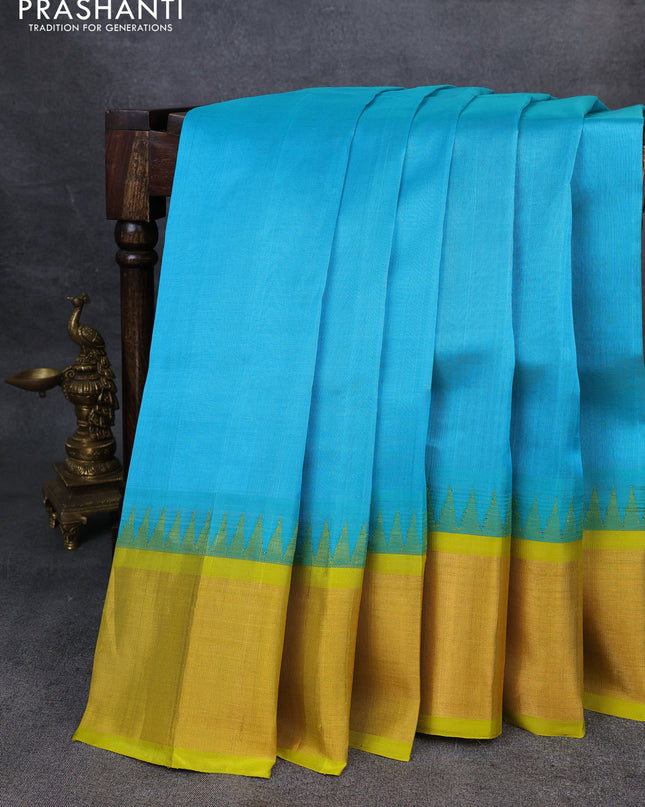 Kuppadam silk cotton saree teal blue and lime yellow with plain body and temple design zari checked border