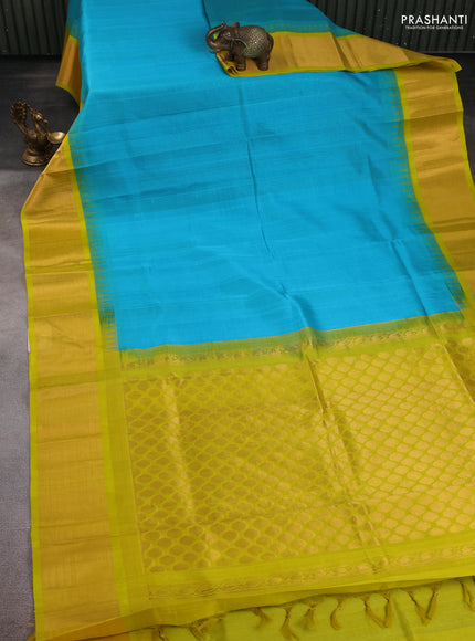 Kuppadam silk cotton saree teal blue and lime yellow with plain body and temple design zari checked border