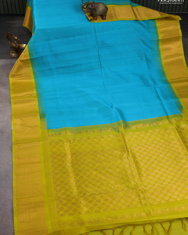 Kuppadam silk cotton saree teal blue and lime yellow with plain body and temple design zari checked border