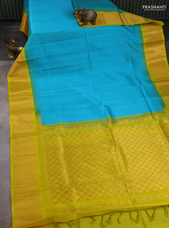 Kuppadam silk cotton saree teal blue and lime yellow with plain body and temple design zari checked border