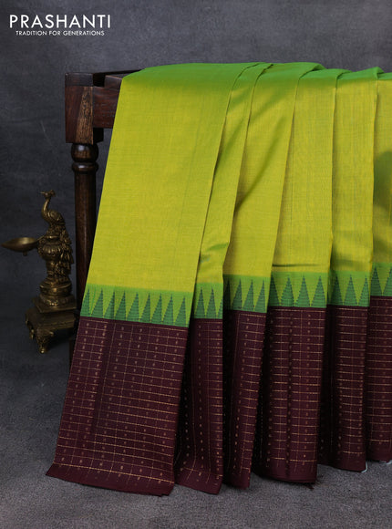 Kuppadam silk cotton saree light green and deep maroon with plain body and temple design zari checked border