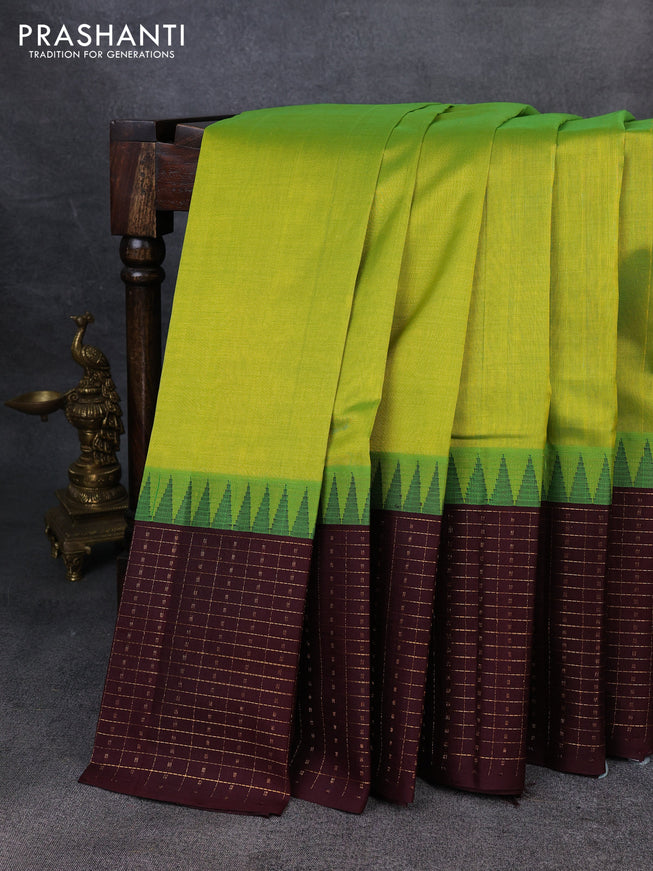 Kuppadam silk cotton saree light green and deep maroon with plain body and temple design zari checked border