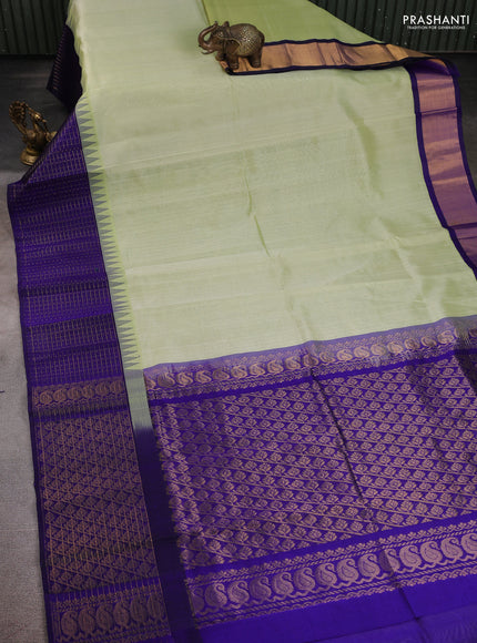 Kuppadam silk cotton saree pista green and blue with plain body and temple design zari checked border