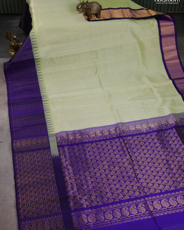 Kuppadam silk cotton saree pista green and blue with plain body and temple design zari checked border