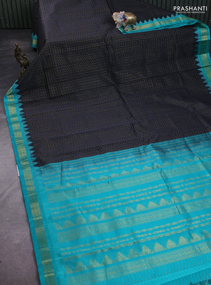 Kuppadam silk cotton saree black and teal blue with allover zari checks & lakshadeepam weaves and zari woven border