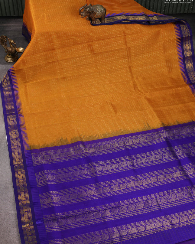 Kuppadam silk cotton saree mustard yellow and blue with allover zari checks & lakshadeepam weaves and zari woven border