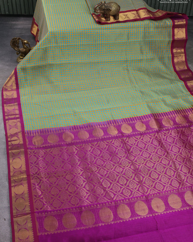 Silk Cotton saree teal green and purple with allover paalum pazhamum checks and zari woven korvai border