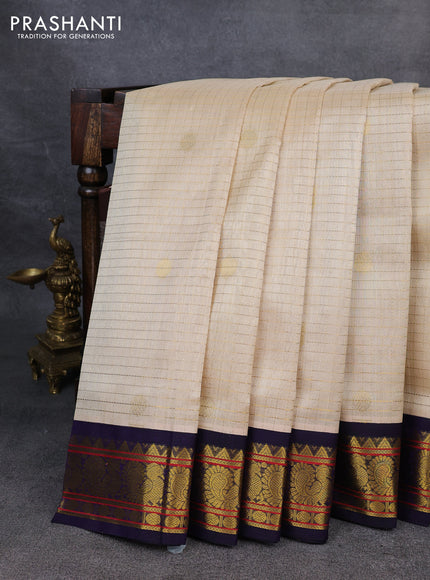 Silk Cotton saree cream and blue with allover zari checks & buttas and zari woven korvai border