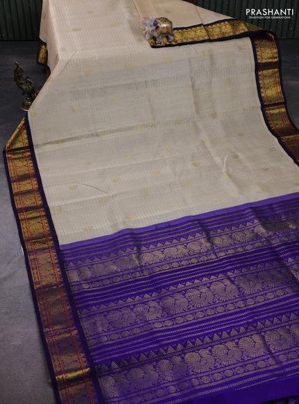 Silk Cotton saree cream and blue with allover zari checks & buttas and zari woven korvai border