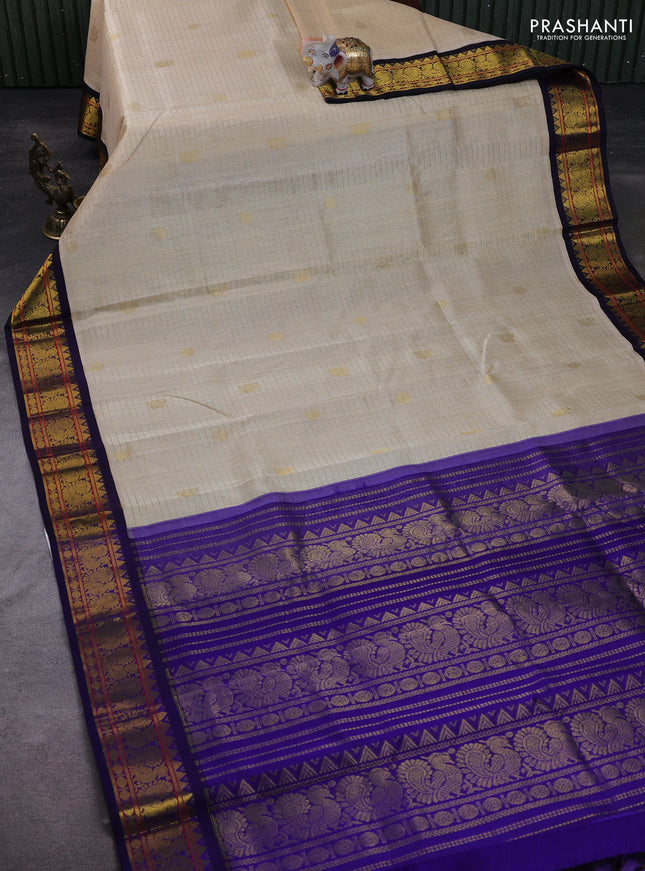 Silk Cotton saree cream and blue with allover zari checks & buttas and zari woven korvai border