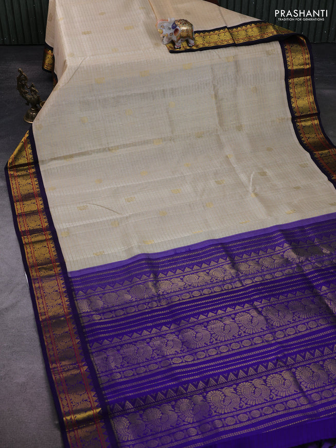 Silk Cotton saree cream and blue with allover zari checks & buttas and zari woven korvai border